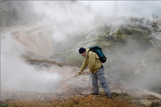 Tommy Phelps looks for bacteria samples at Yellowstone National Park.