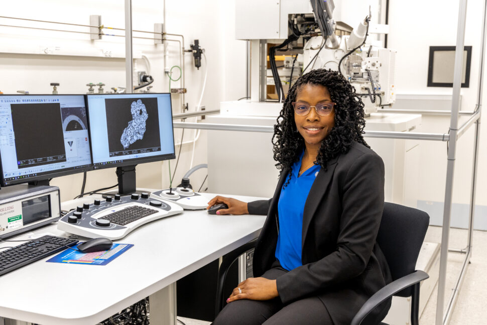 An employee at ORNL sits in front of a computer
