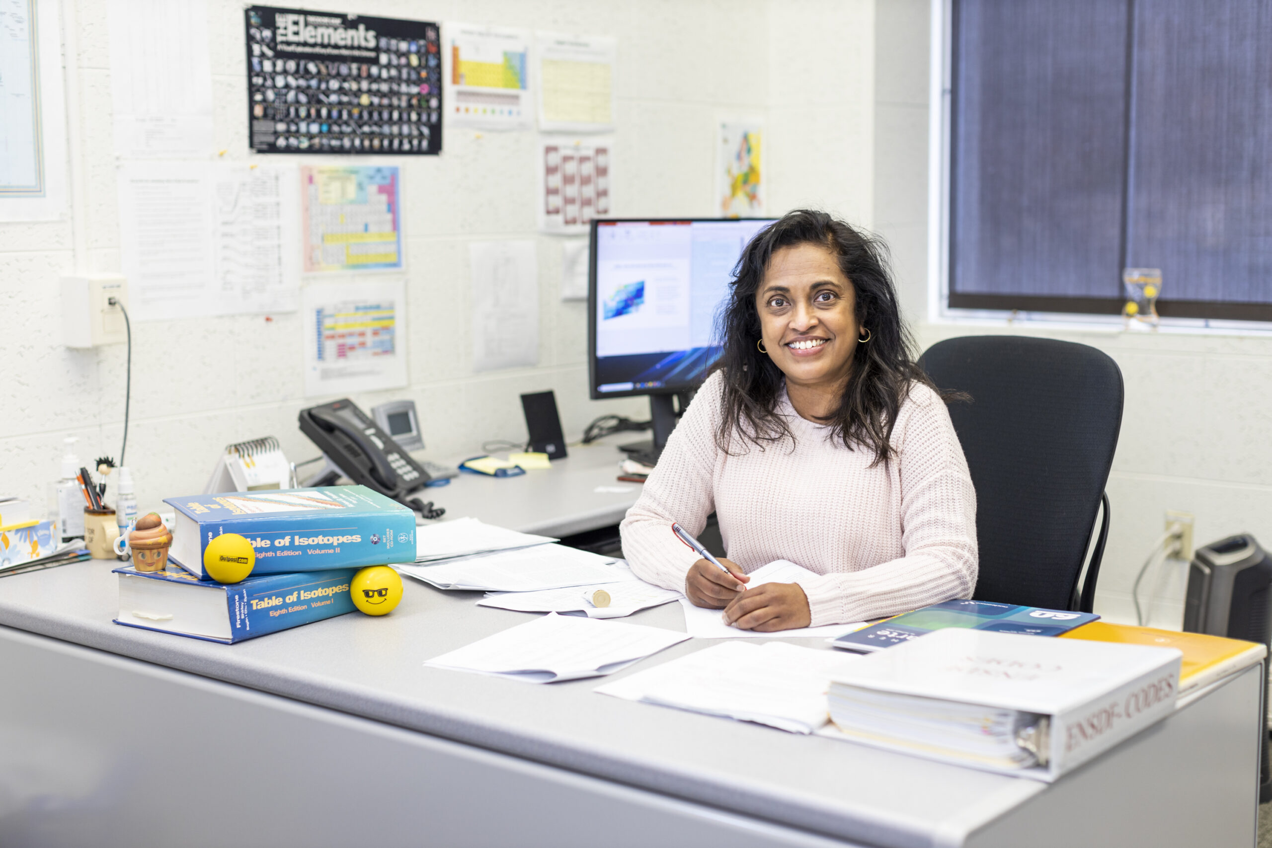 Nesaraja evaluates mass chains assigned to nuclear data program centers like ORNL. She selects best values for archiving in a specialized nuclear structure database and publication. Credit: Carlos Jones/ORNL, U.S. Dept. of Energy