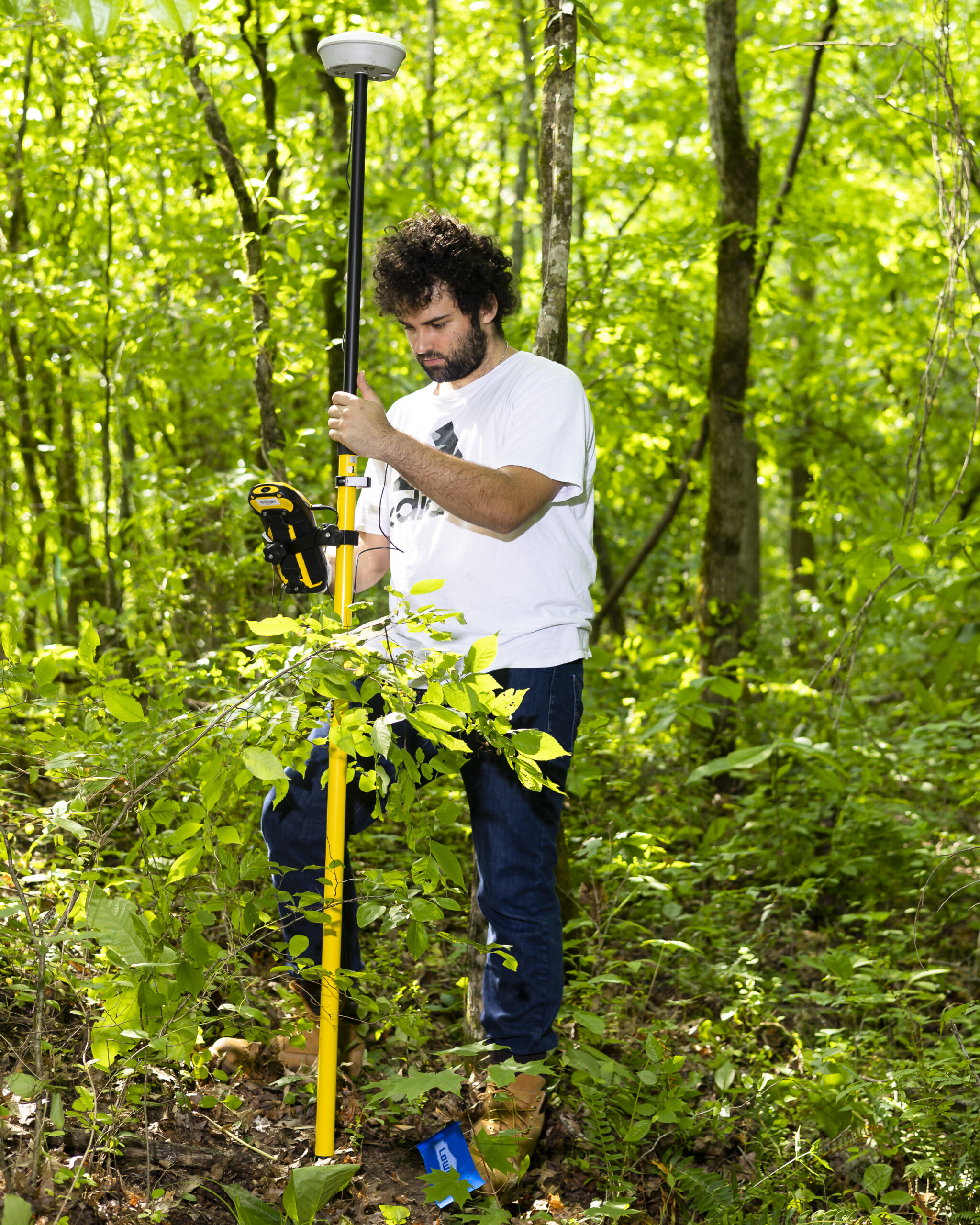 Student Aubrey Elwes conducts field sampling at ORNL. Credit: Carlos Jones/ORNL. U.S. Dept. of Energy