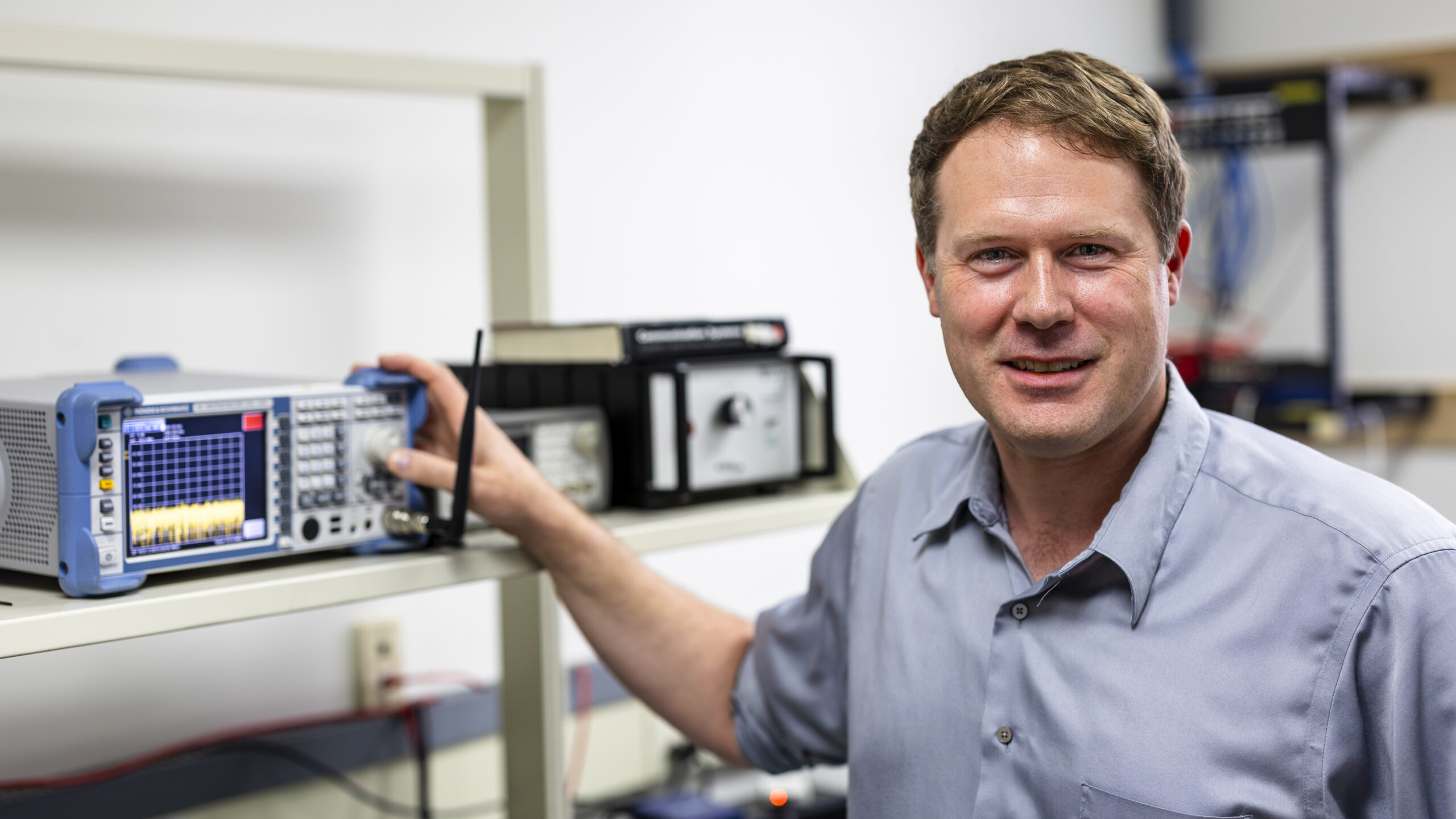 Corey Cooke is pictured standing next to radar technology