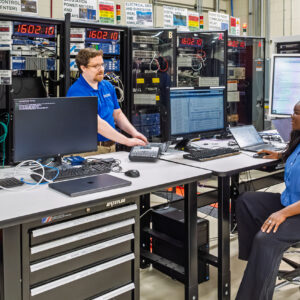 Aaron Werth discusses cybersecurity platform scenarios with GridForge founder and CEO Worlasie Djameh at the Hardin Valley Campus Grid-C facility.