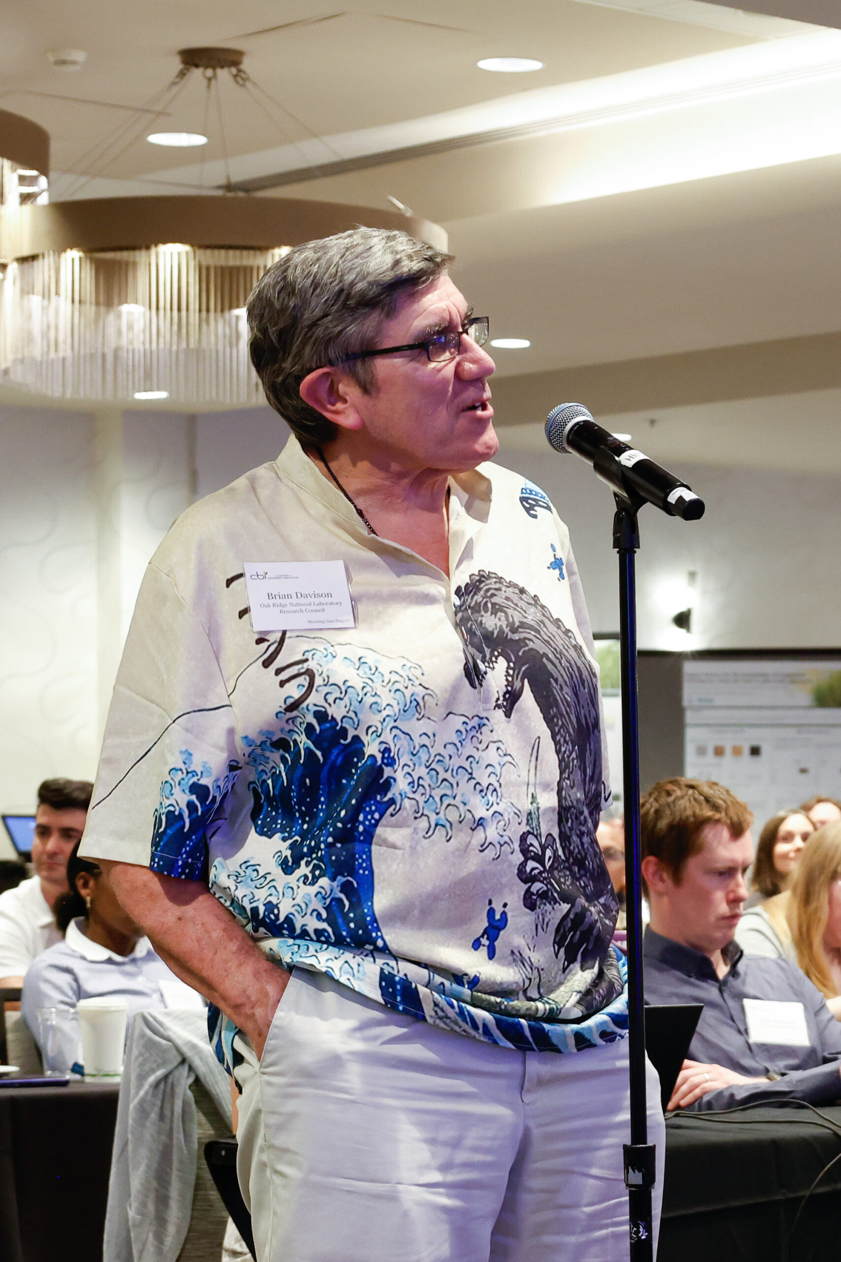 ORNL researcher Brian Davison is standing at the microphone during the Center for Bioenergy Innovation annual science meeting.