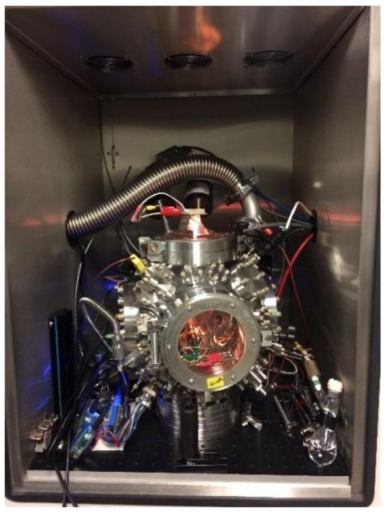 Metal box enclosing a complex microscope with many wires