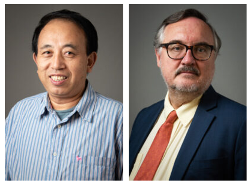 Two researchers pose for a side by side headshot, smiling with gray background