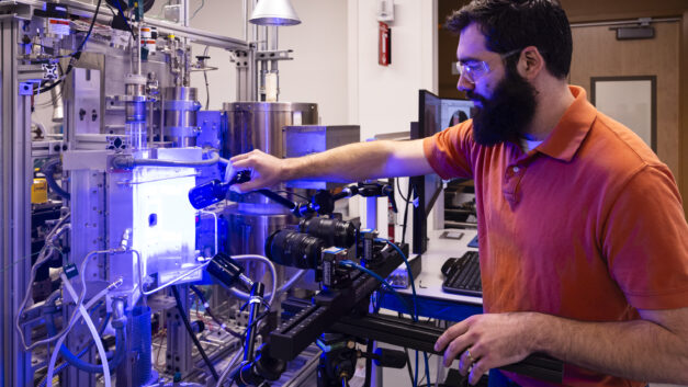 Mackenzie Ridley, John Wade, Nathan Capps, and Brandon Johnston work at the Severe Accident Testing Station in the Thermal Hydraulics Research Center at ORNL.