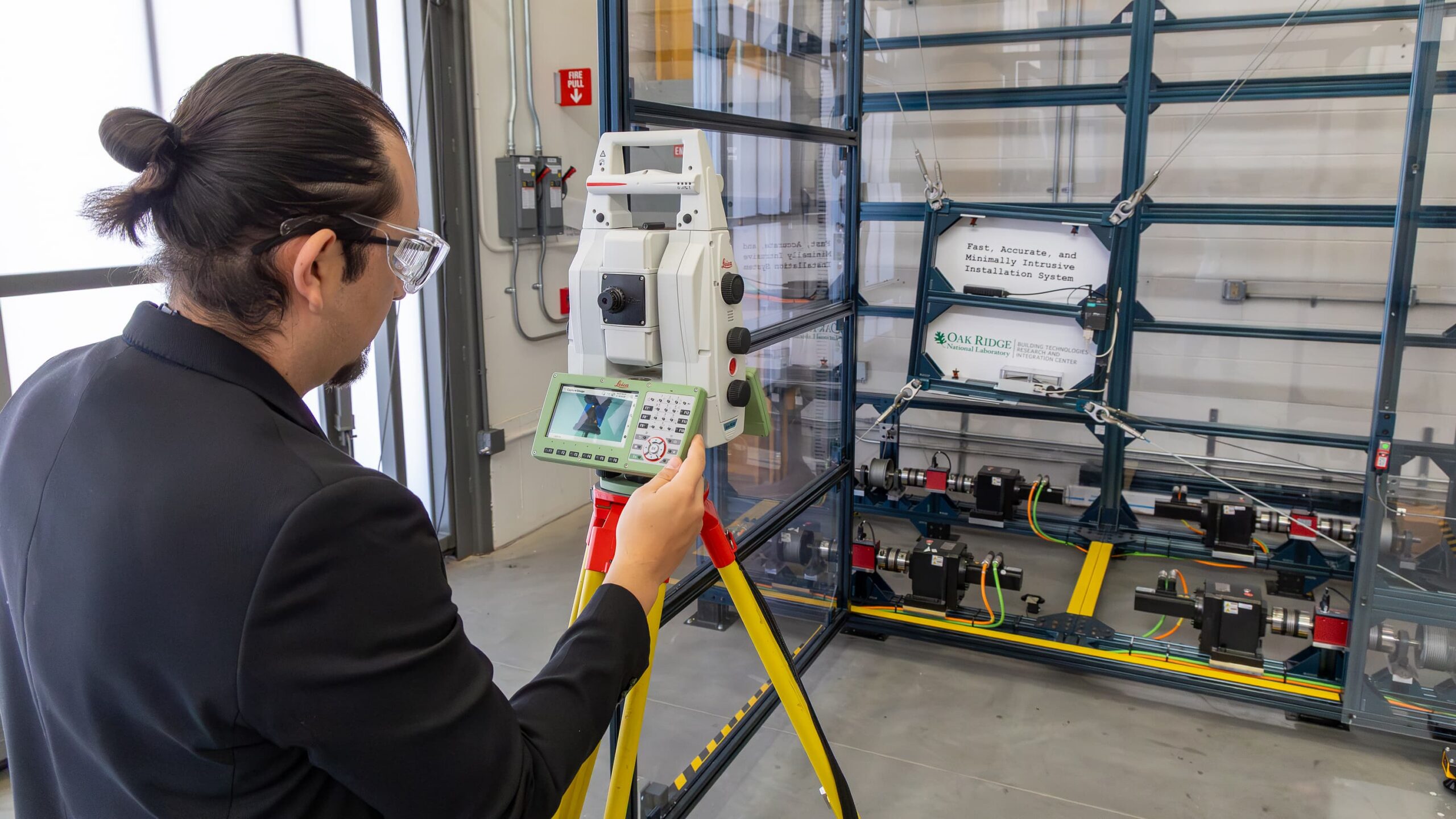 Bryan Maldonado Puente, R&D staff member in Building Envelope Materials Research, calibrates measurement equipment in the Manufacturing Demonstration Facility’s MaxLab at Oak Ridge National Laboratory’s Building Technologies Research and Integration Center (BTRIC) campus.