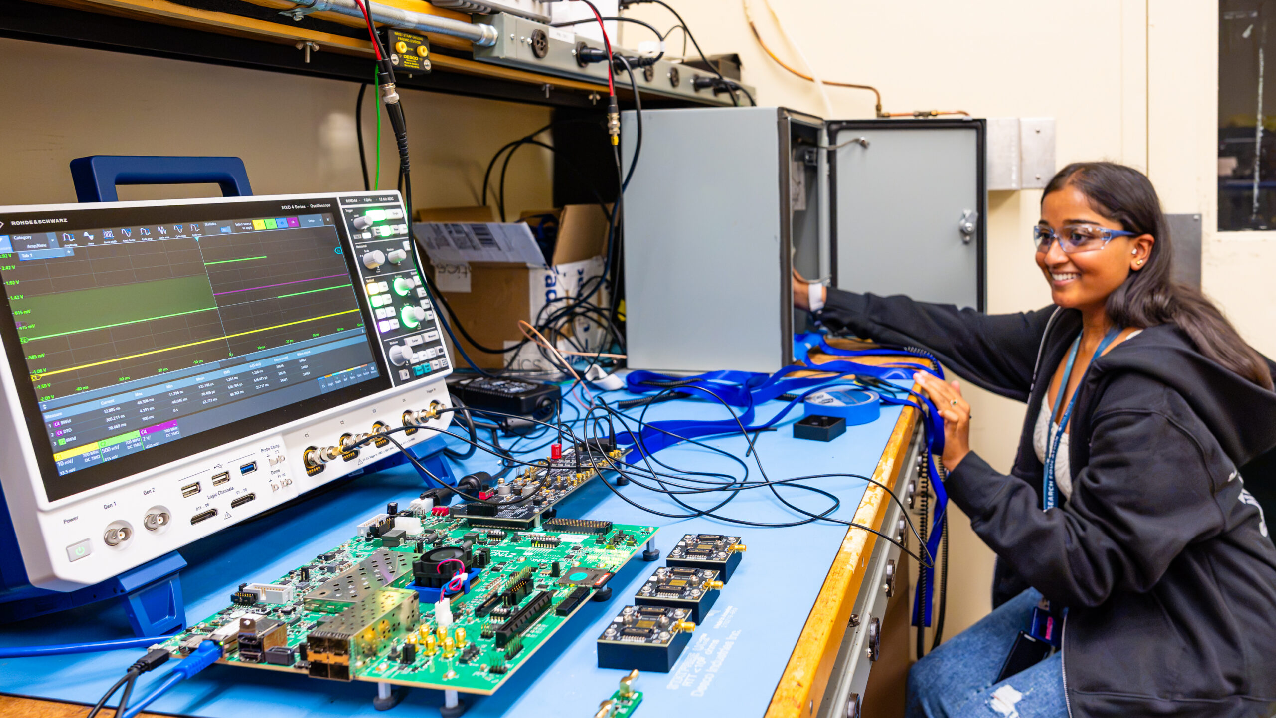 Intern Maushmi Maran poses in her laboratory space.