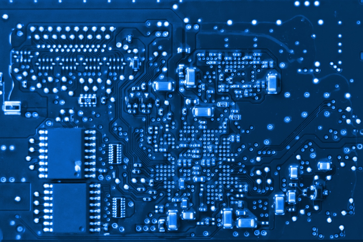Close up of PCB board and IC chip, Electronic circuit board. Image from Envato