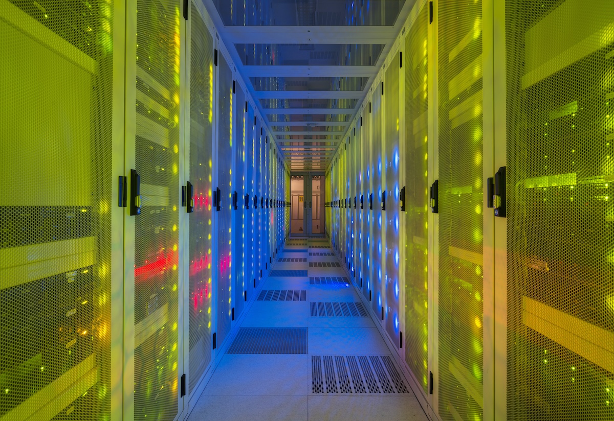 Datacenter with yellow light overlay. Image from Envato.