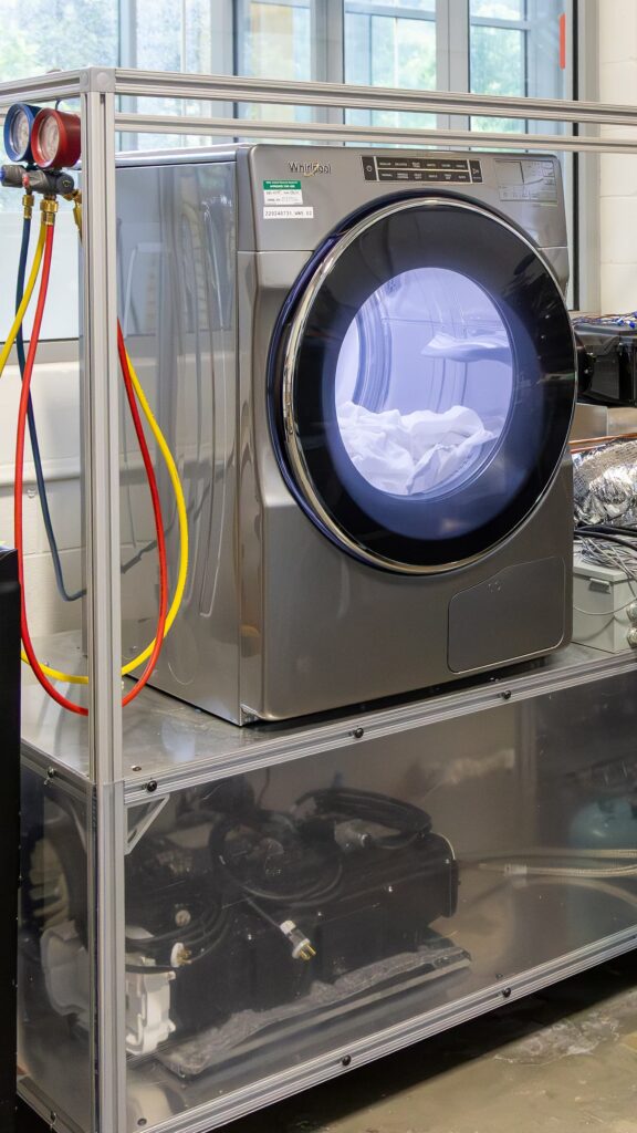 A next-generation ventless heat pump combined washer-dryer integrated with a thermal energy storage module.