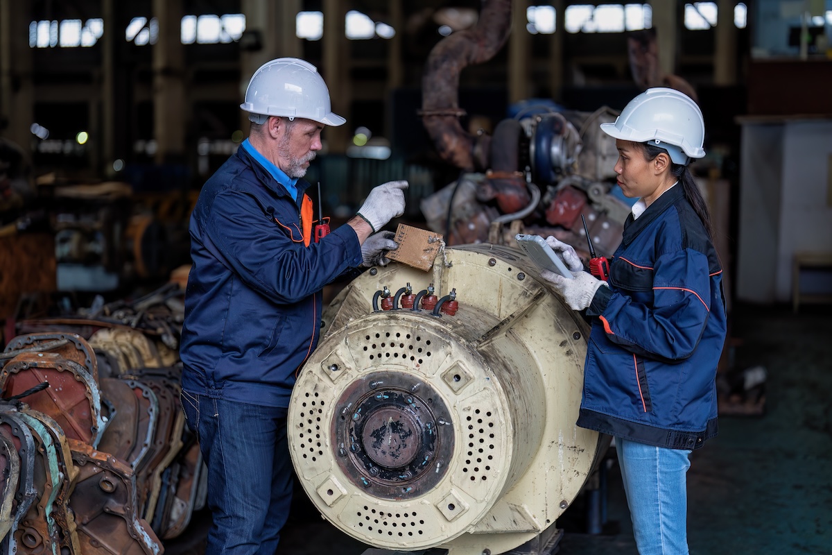 Maintenance manager and engineer checking part large engine supercharger. Image from Envato