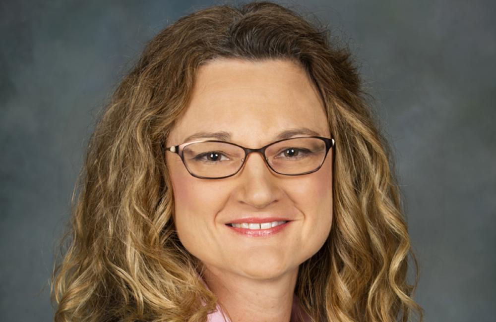 Portrait of Roxann Walsh.