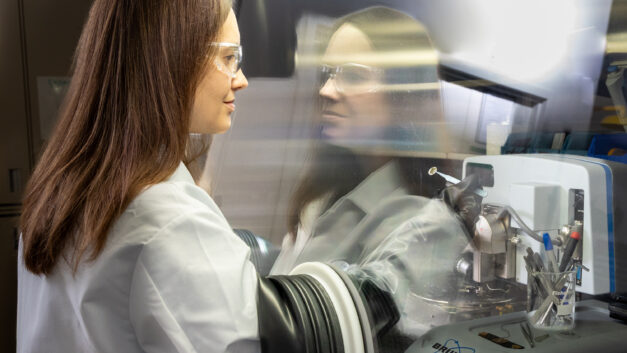 A female scientist working in a glovebox