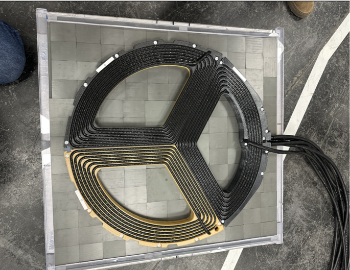 Wireless electric vehicle charging coil developed for a BMW.